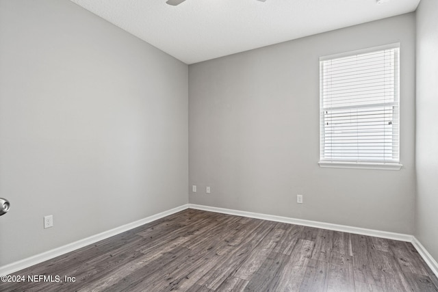 empty room featuring wood-type flooring and ceiling fan