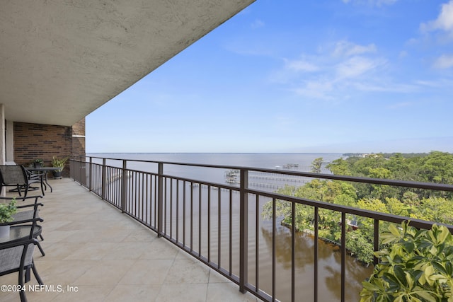 balcony featuring a water view