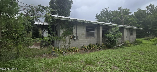 view of property exterior featuring a yard