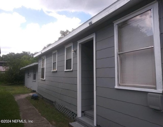 view of side of property with crawl space