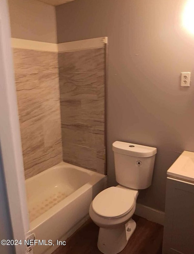 full bathroom with vanity, plus walk in shower, and toilet