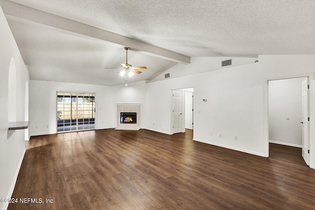 unfurnished living room with ceiling fan, vaulted ceiling with beams, a textured ceiling, and dark hardwood / wood-style flooring