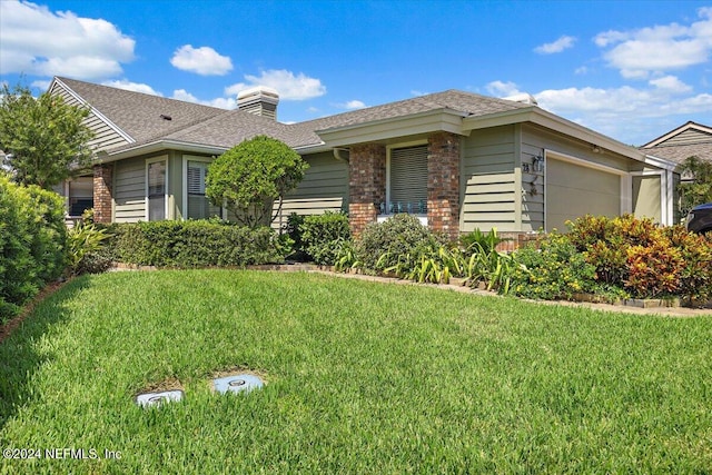 ranch-style home with a front lawn