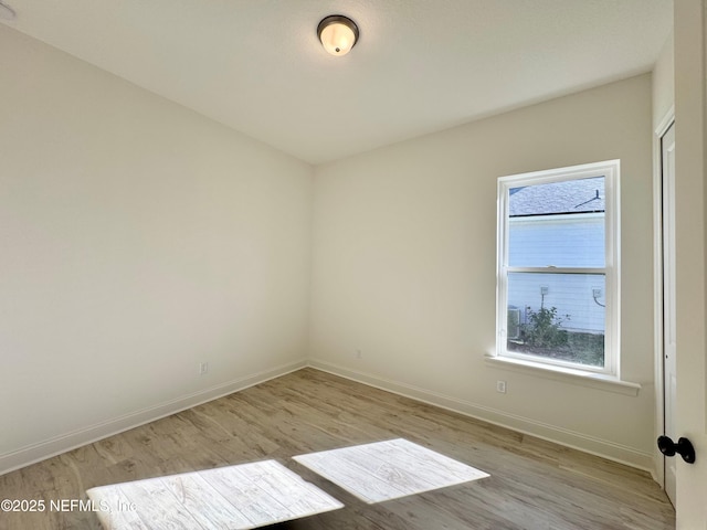 unfurnished room featuring light hardwood / wood-style flooring