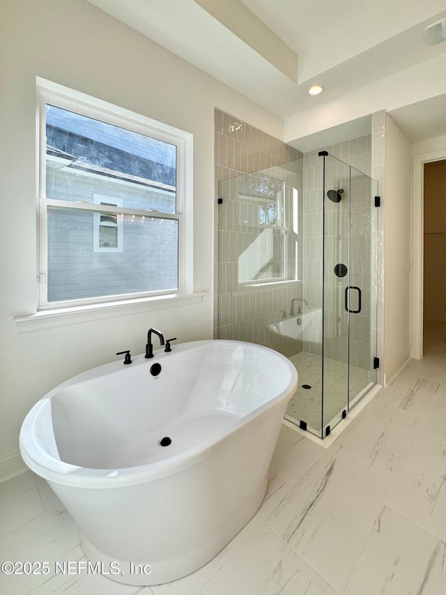 bathroom with shower with separate bathtub