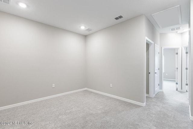 empty room featuring light colored carpet