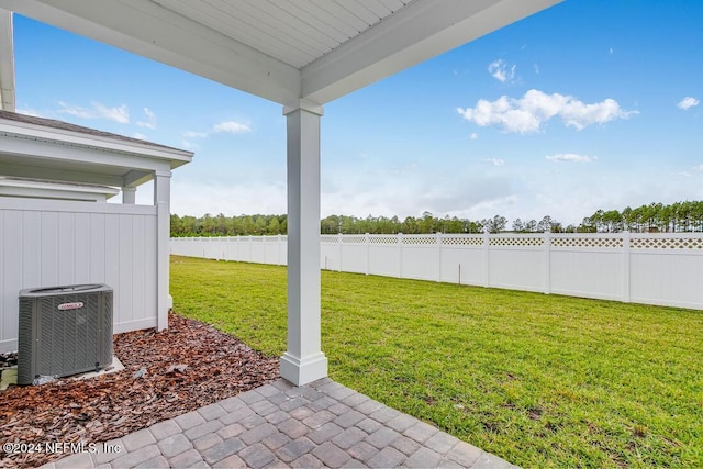 view of yard with a patio area and central air condition unit