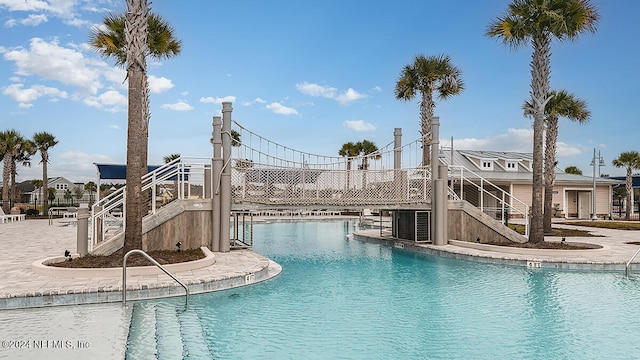 view of swimming pool featuring central air condition unit