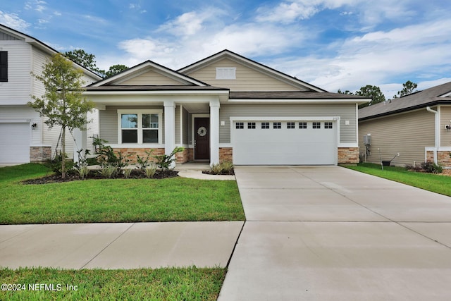 craftsman-style house with a front lawn