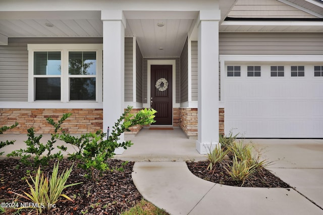 entrance to property featuring a garage