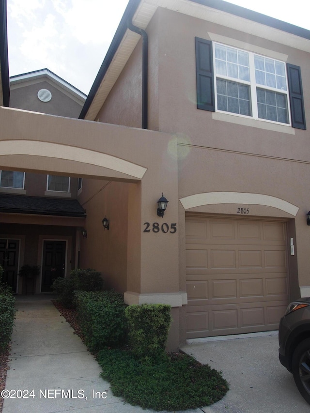 view of front of home with a garage