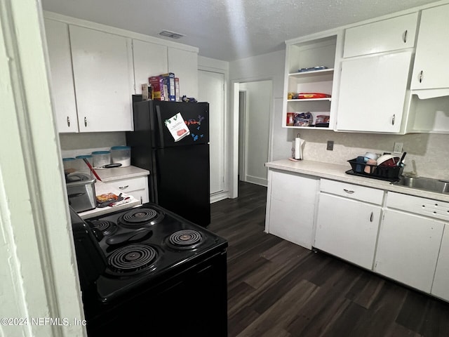 kitchen with sink, a textured ceiling, dark hardwood / wood-style flooring, black appliances, and white cabinets