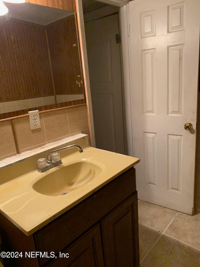 bathroom featuring tile patterned flooring and vanity