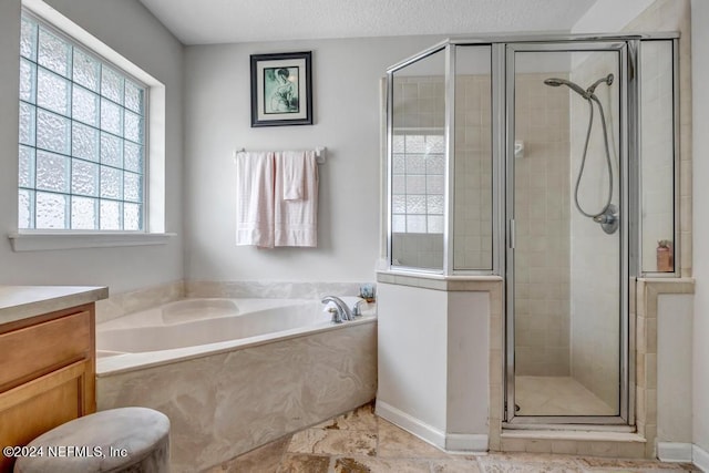 bathroom with plus walk in shower and vanity