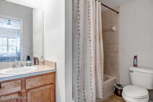 full bathroom featuring vanity, shower / tub combo, ceiling fan, and toilet