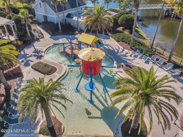 view of swimming pool with a water view and a playground