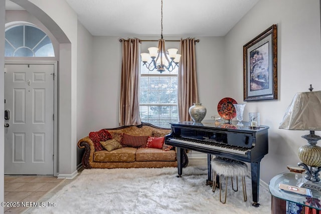 interior space featuring a chandelier and tile patterned flooring