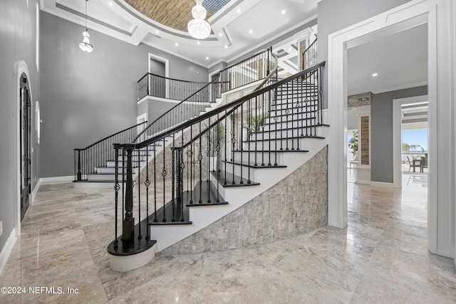 stairway with baseboards, ornamental molding, marble finish floor, a high ceiling, and recessed lighting