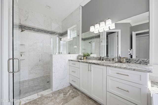 bathroom with a stall shower, marble finish floor, crown molding, and vanity