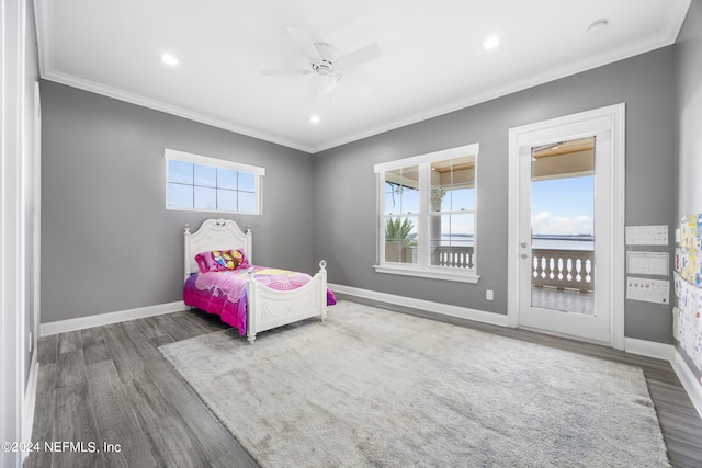 bedroom featuring multiple windows, baseboards, and crown molding