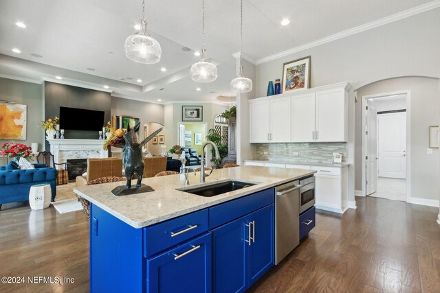 kitchen with stainless steel dishwasher, dark hardwood / wood-style floors, and an island with sink