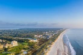 aerial view featuring a beach view and a water view