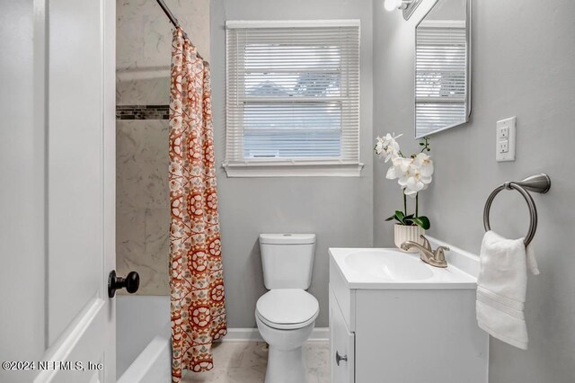 full bathroom with toilet, shower / tub combo, tile patterned flooring, and vanity