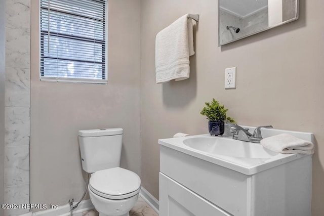 bathroom featuring toilet, vanity, and tile patterned floors