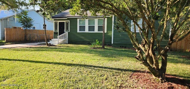 bungalow with a front lawn