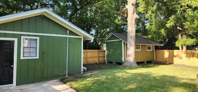 view of outdoor structure featuring a lawn