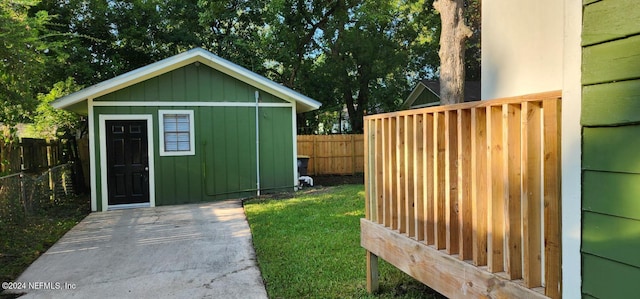 view of outbuilding with a lawn