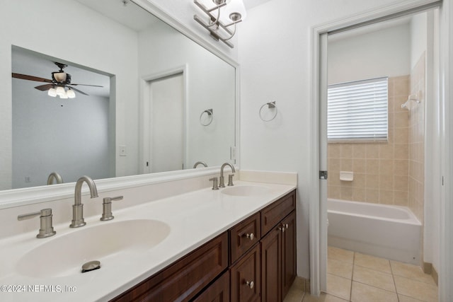 bathroom with tile patterned flooring, ceiling fan, double vanity, and tiled shower / bath combo