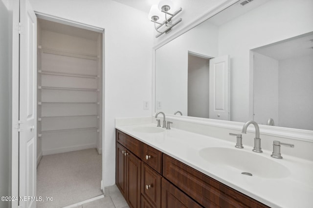 bathroom featuring dual vanity and tile patterned flooring