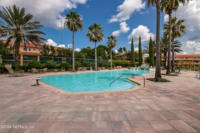 view of swimming pool featuring a patio area