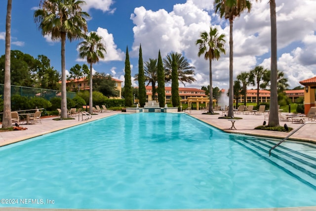 view of swimming pool with a patio area