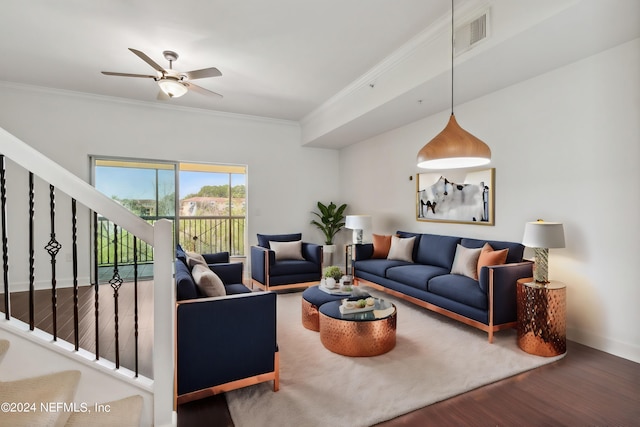 living room with ceiling fan, hardwood / wood-style flooring, and crown molding