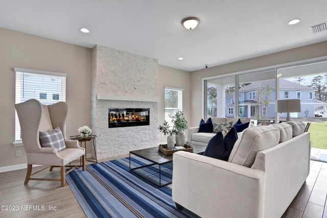 living room featuring a fireplace and hardwood / wood-style floors