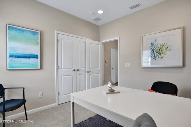 office space featuring recessed lighting, baseboards, visible vents, and light colored carpet