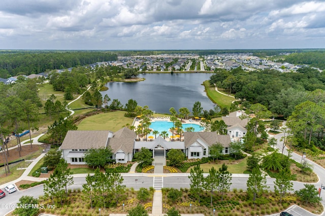 birds eye view of property with a water view