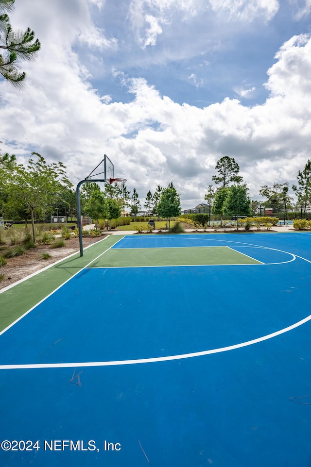 view of sport court featuring community basketball court and fence