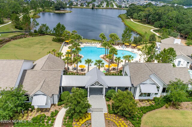 birds eye view of property with a water view