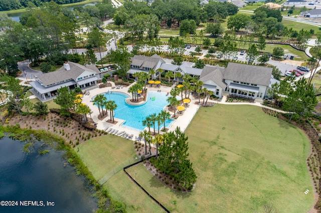 bird's eye view featuring a water view and a residential view