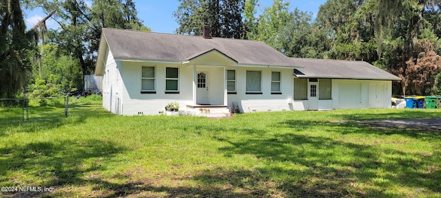 ranch-style house with a front lawn