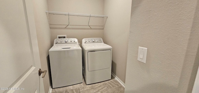 washroom with separate washer and dryer