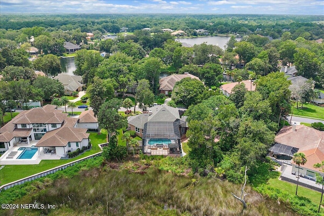 bird's eye view featuring a water view and a residential view