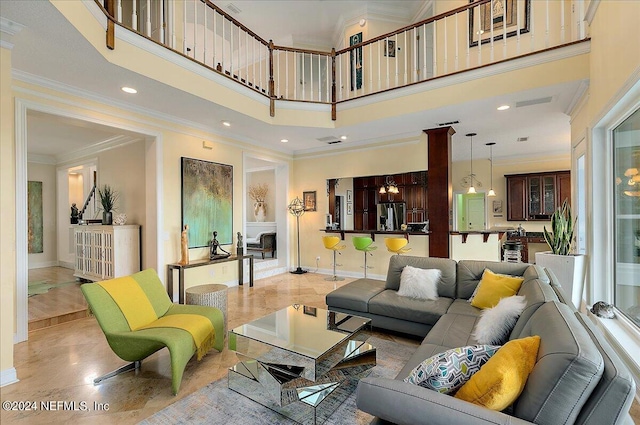 living area featuring recessed lighting, a towering ceiling, baseboards, marble finish floor, and crown molding