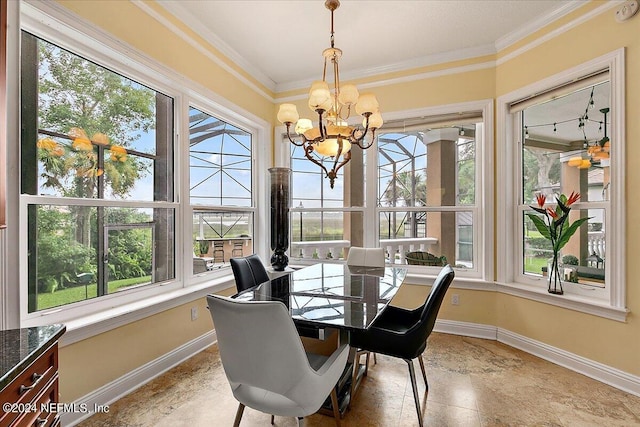 sunroom / solarium featuring a chandelier and a healthy amount of sunlight