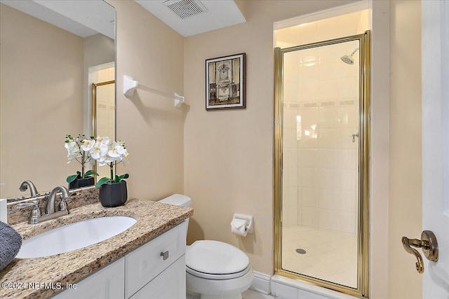 bathroom featuring visible vents, a shower stall, toilet, and vanity