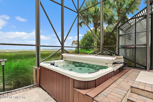 unfurnished sunroom with a jacuzzi