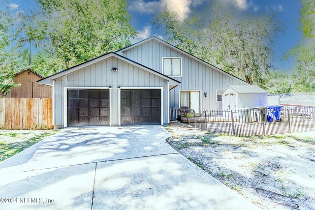 view of front of house with an outdoor structure and a garage